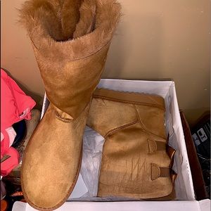 Tan boots with bows on back